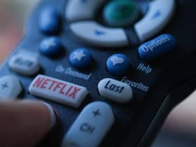 In this illustration photo taken on July 19, 2022 the Netflix logo is seen on a TV remote in Los Angeles. - Netflix reported losing subscribers for the second quarter in a row Tuesday as the streaming giant battles fierce competition and viewer belt tightening, but the company assured investors of better days ahead. The loss of 970,000 paying customers in the most recent quarter was not as big as expected, and left Netflix with just shy of 221 million subscribers. (Photo by Chris DELMAS / AFP) (Photo by CHRIS DELMAS/AFP via Getty Images)
