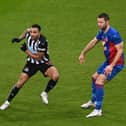 NEWCASTLE UPON TYNE, ENGLAND - FEBRUARY 02: Crystal Palace defender Gary Cahill (r) and Jairo Riedewald challenge Callum Wilson of Newcastle during the Premier League match between Newcastle United and Crystal Palace at St. James Park on February 02, 2021 in Newcastle upon Tyne, England.
