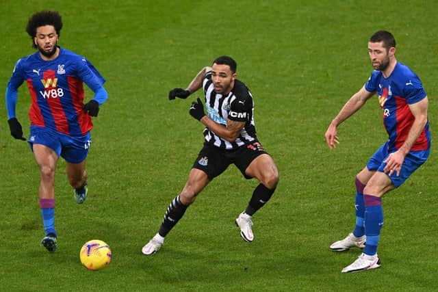 NEWCASTLE UPON TYNE, ENGLAND - FEBRUARY 02: Crystal Palace defender Gary Cahill (r) and Jairo Riedewald challenge Callum Wilson of Newcastle during the Premier League match between Newcastle United and Crystal Palace at St. James Park on February 02, 2021 in Newcastle upon Tyne, England.