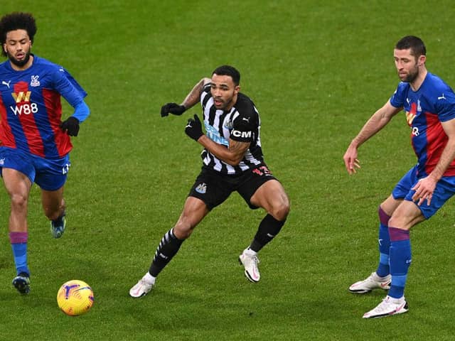NEWCASTLE UPON TYNE, ENGLAND - FEBRUARY 02: Crystal Palace defender Gary Cahill (r) and Jairo Riedewald challenge Callum Wilson of Newcastle during the Premier League match between Newcastle United and Crystal Palace at St. James Park on February 02, 2021 in Newcastle upon Tyne, England.