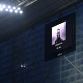 The LED board shows an image of former Premier League player Christian Atsu. (Photo by Stu Forster/Getty Images).