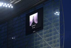 The LED board shows an image of former Premier League player Christian Atsu. (Photo by Stu Forster/Getty Images).