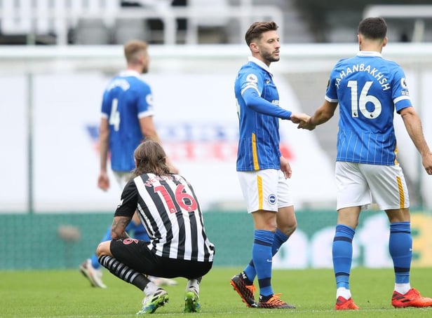 Brighton's English midfielder Adam Lallana (C) and Brighton's Iranian midfielder Alireza Jahanbakhsh (R) react after winning the English Premier League football match between Newcastle United and Brighton and Hove Albion at St James' Park in Newcastle upon Tyne, north-east England on September 20, 2020.