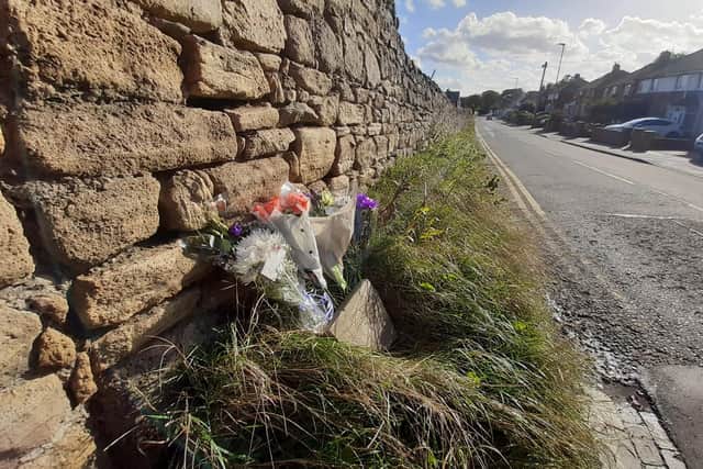 Floral tributes left at the scene in Lizard Lane