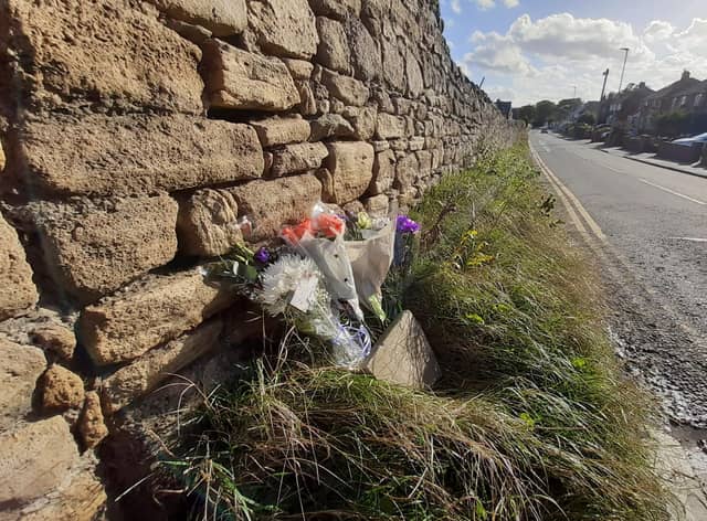 Floral tributes left at the scene in Lizard Lane