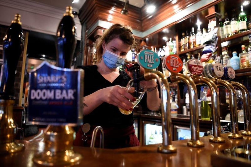 Restaurants, pubs, bars and cafes can open indoors until 10.30pm serving alcohol with two hour pre-booked slots. (Picture: AFP via Getty Images)