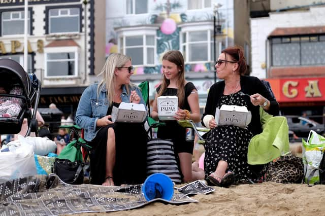 Enjoying fish and chips on the beach