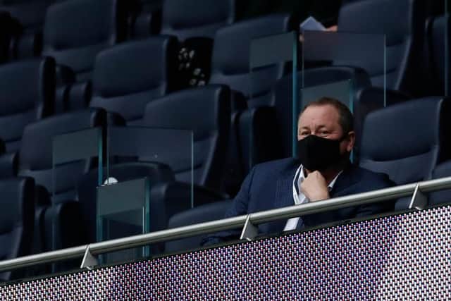 Mike Ashley watches a Newcastle United game last year.