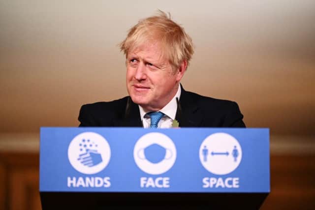 Prime Minister Boris Johnson answers questions during a briefing on the current coronavirus pandemic, in Downing Street