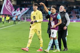 CJ Egan-Riley points to man of the match James Trafford after his two penatly saves against Sunderland. Photo: Kelvin Lister-Stuttard
