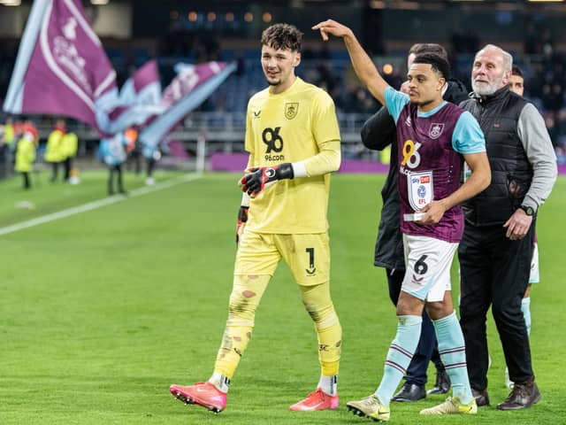 CJ Egan-Riley points to man of the match James Trafford after his two penatly saves against Sunderland. Photo: Kelvin Lister-Stuttard