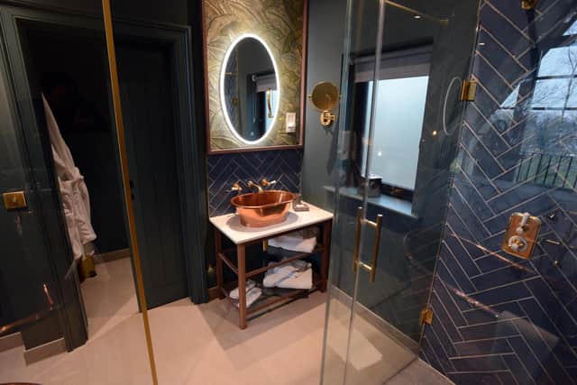 The upstairs en-suite, complete with robes