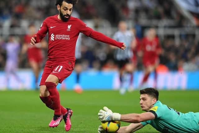 Nick Pope handles the ball outside his box against Liverpool.