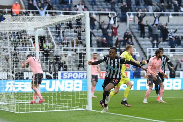 Newcastle player Joe Willock celebrates after scoring the winning goal during the Premier League match between Newcastle United and Sheffield United at St. James Park on May 19, 2021 in Newcastle upon Tyne, England.