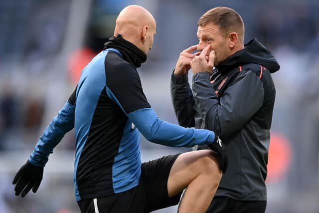 Jonjo Shelvey of Newcastle United speaks with Graeme Jones (Photo by Stu Forster/Getty Images)