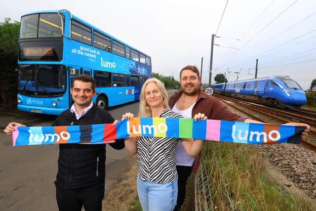 Bus driver Dan Graham with charity singers Susan Bicke and Stuart Angus