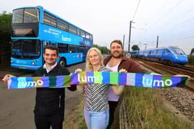 Bus driver Dan Graham with charity singers Susan Bicke and Stuart Angus