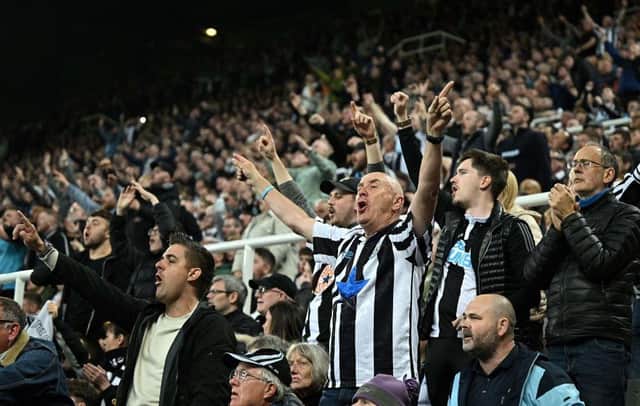 Newcastle fans celebrate Premier League match between Newcastle United and Arsenal at St James' Park  (Photo by OLI SCARFF/AFP via Getty Images)