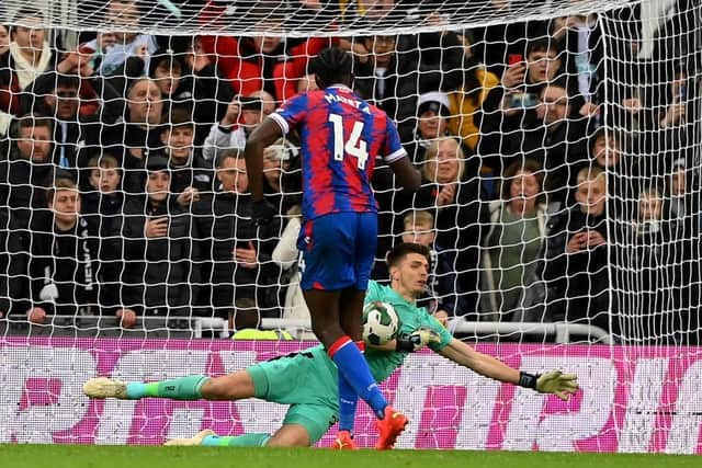Nick Pope of Newcastle United saves a penalty taken by Jean-Philippe Mateta of Crystal Palace during a penalty shoot out during the Carabao Cup Third Round match between Newcastle United and Crystal Palace at St James' Park on November 09, 2022 in Newcastle upon Tyne, England. (Photo by Stu Forster/Getty Images)
