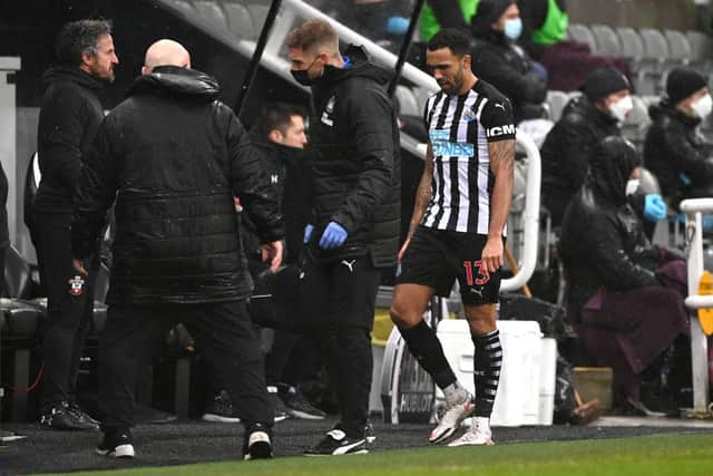 Callum Wilson leaves the field injured.