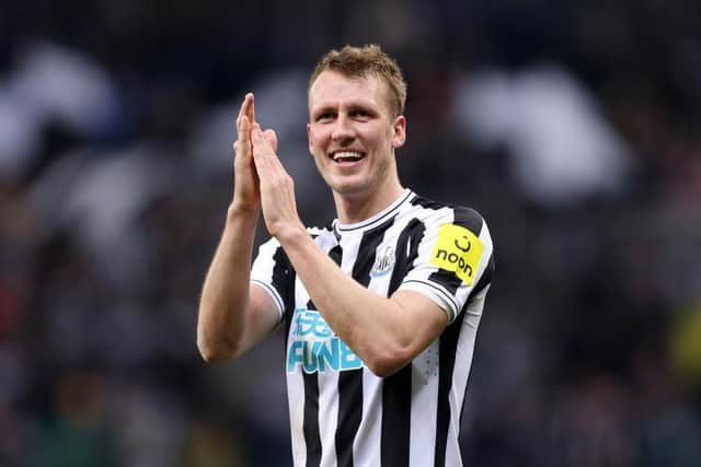 Newcastle United's Dan Burn celebrates the club's Carabao Cup win over Leicester City.