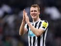 Newcastle United's Dan Burn celebrates the club's Carabao Cup win over Leicester City.