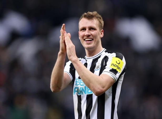 Newcastle United's Dan Burn celebrates the club's Carabao Cup win over Leicester City.