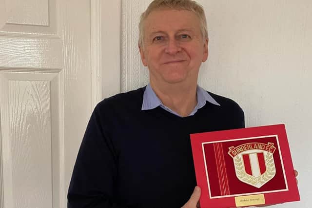 Stuart with the birthday card he has treasured for 50 years.