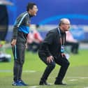 Dalian Pro coach Rafael Benitez (R) watches his players during their their Chinese Super League match against Shanghai Shenhua in Dalian, in China's northeast Liaoning province on August 10, 2020. (Photo by STR / AFP) / China OUT (Photo by STR/AFP via Getty Images)