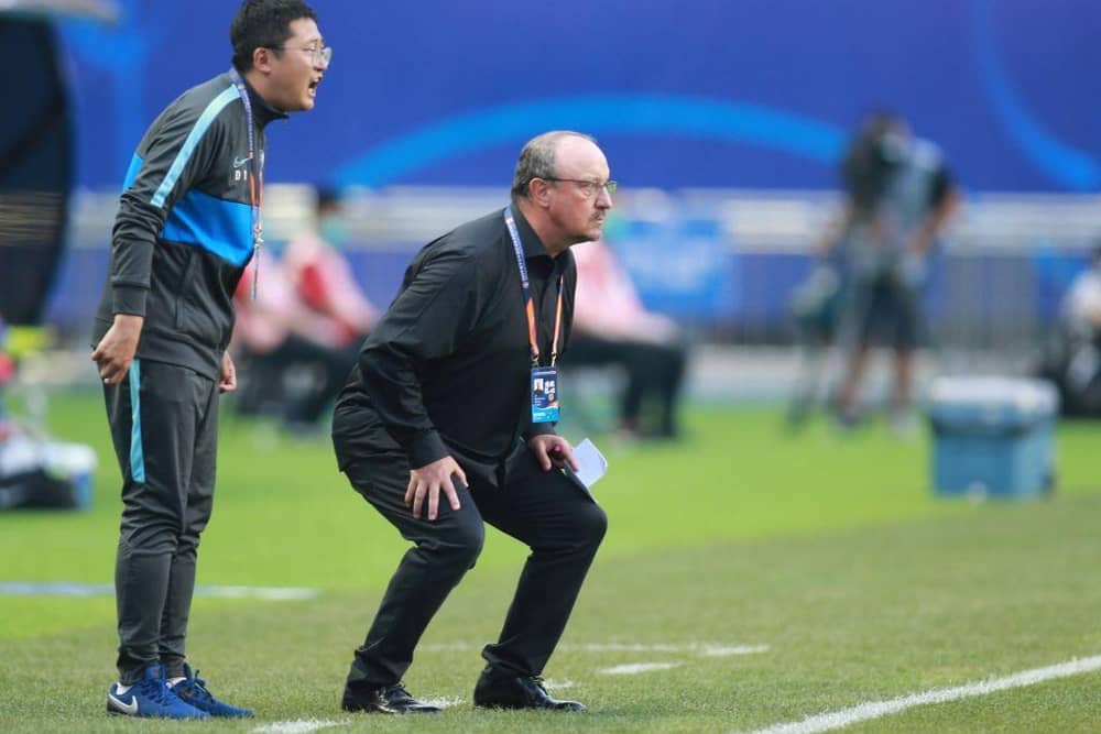 Dalian Pro coach Rafael Benitez (R) watches his players during their their Chinese Super League match against Shanghai Shenhua in Dalian, in China's northeast Liaoning province on August 10, 2020. (Photo by STR / AFP) / China OUT (Photo by STR/AFP via Getty Images)