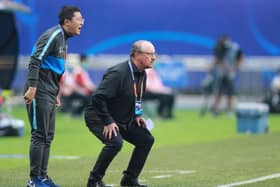 Dalian Pro coach Rafael Benitez (R) watches his players during their their Chinese Super League match against Shanghai Shenhua in Dalian, in China's northeast Liaoning province on August 10, 2020. (Photo by STR / AFP) / China OUT (Photo by STR/AFP via Getty Images)