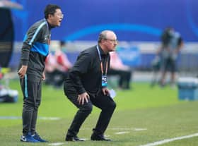 Dalian Pro coach Rafael Benitez (R) watches his players during their their Chinese Super League match against Shanghai Shenhua in Dalian, in China's northeast Liaoning province on August 10, 2020. (Photo by STR / AFP) / China OUT (Photo by STR/AFP via Getty Images)