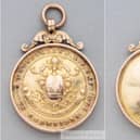 Both sides of Jimmy Watson's 1901-02 championship medal. Image from Graham Budd.