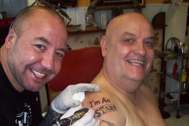 As well as being Mensi's friend, Chris Wright was also his tattooist.