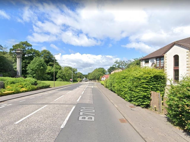 Three-way temporary traffic lights for manhole repairs at Redford Walk.