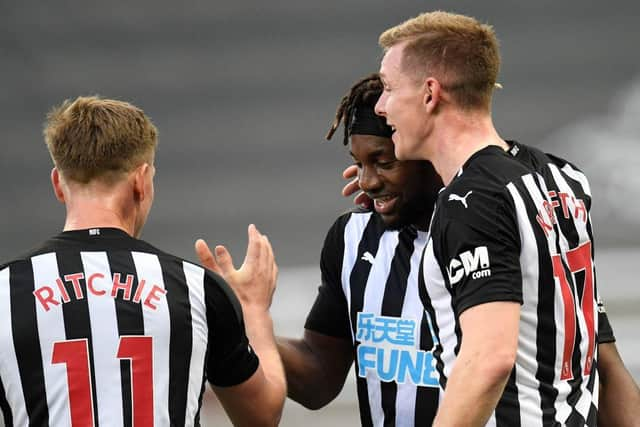 Emil Krafth, right, celebrates is goal with Allan Saint-Maximin and Matt Ritchie.