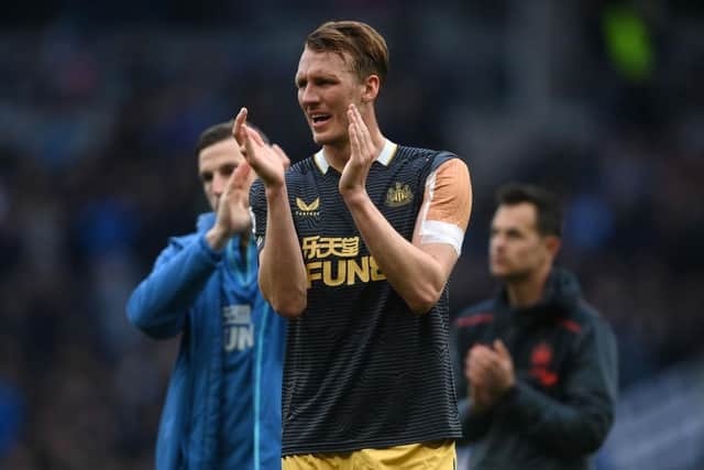 Dan Burn of Newcastle United applauds the fans following defeat in the Premier League match between Tottenham Hotspur and Newcastle United at Tottenham Hotspur Stadium on April 03, 2022 in London, England. (Photo by Mike Hewitt/Getty Images)