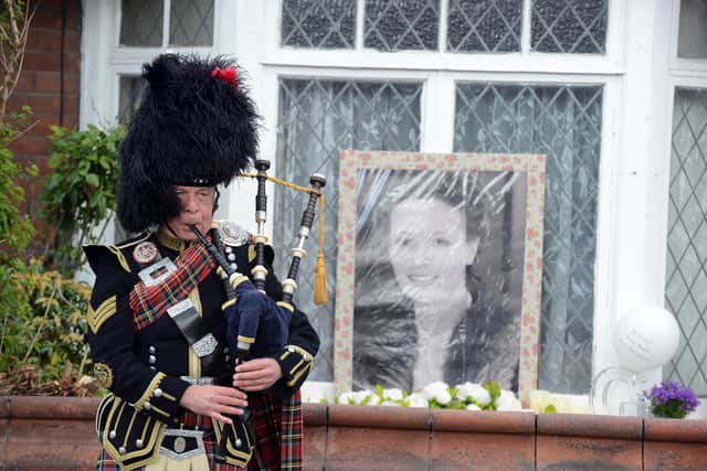 Bagpiper at the funeral procession