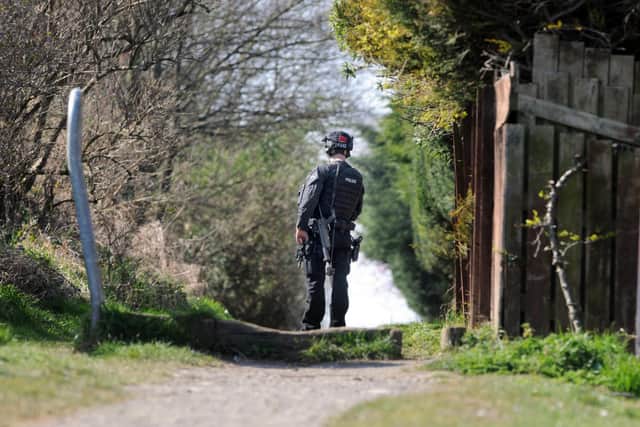 Armed responce officer at Old Marsden Quarry during man hunt