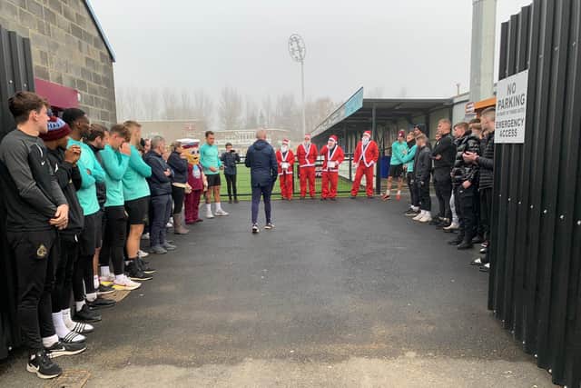 Jak's uncles and cousin are greeted by the South Shields FC players.