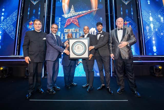 (l-r) Lord Karan Bilimoria, founder of Cobra Beer, Minister for London Paul Scully MP, Syed Ahmed - Editor of Curry Life, Namaste team receiving the awards from the Celebrity host Adam Boulton.