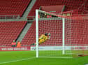 Alex Pritchard hits the bar with a late free kick