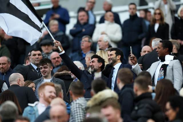 Newcastle United chairman Yasir Al-Rumayyan waving a flag pre-match ahead of the clash with Crystal Palace (Photo by Ian MacNicol/Getty Images)