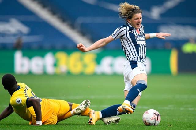 Tottenham Hotspur's French midfielder Tanguy Ndombele (L) challenges West Bromwich Albion's English midfielder Conor Gallagher (R) during the English Premier League football match between West Bromwich Albion and Tottenham Hotspur at The Hawthorns stadium in West Bromwich, central England, on November 8, 2020.