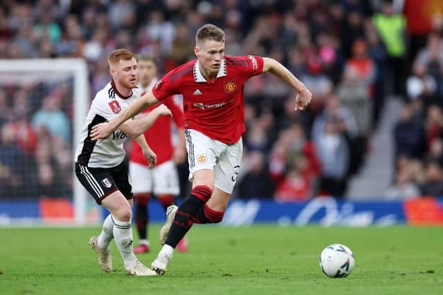 Scott McTominay of Manchester United battles for possession with Harrison Reed of Fulham during the Emirates FA Cup Quarter Final match between Manchester United and Fulham at Old Trafford on March 19, 2023 in Manchester, England. (Photo by Clive Brunskill/Getty Images)