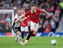 Scott McTominay of Manchester United battles for possession with Harrison Reed of Fulham during the Emirates FA Cup Quarter Final match between Manchester United and Fulham at Old Trafford on March 19, 2023 in Manchester, England. (Photo by Clive Brunskill/Getty Images)