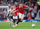 Scott McTominay of Manchester United battles for possession with Harrison Reed of Fulham during the Emirates FA Cup Quarter Final match between Manchester United and Fulham at Old Trafford on March 19, 2023 in Manchester, England. (Photo by Clive Brunskill/Getty Images)