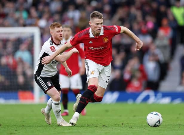Scott McTominay of Manchester United battles for possession with Harrison Reed of Fulham during the Emirates FA Cup Quarter Final match between Manchester United and Fulham at Old Trafford on March 19, 2023 in Manchester, England. (Photo by Clive Brunskill/Getty Images)