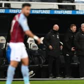 Newcastle manager Steve Bruce (c) and his coaches react during the Premier League match between Newcastle United and Aston Villa at St. James Park on March 12, 2021 in Newcastle upon Tyne, England.