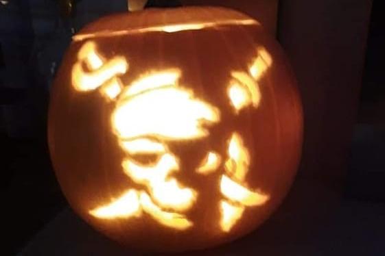 A pirate-inspired skull design on this Halloween pumpkin. Celebrating National Pumpkin Day and Halloween with Christine Cheal.